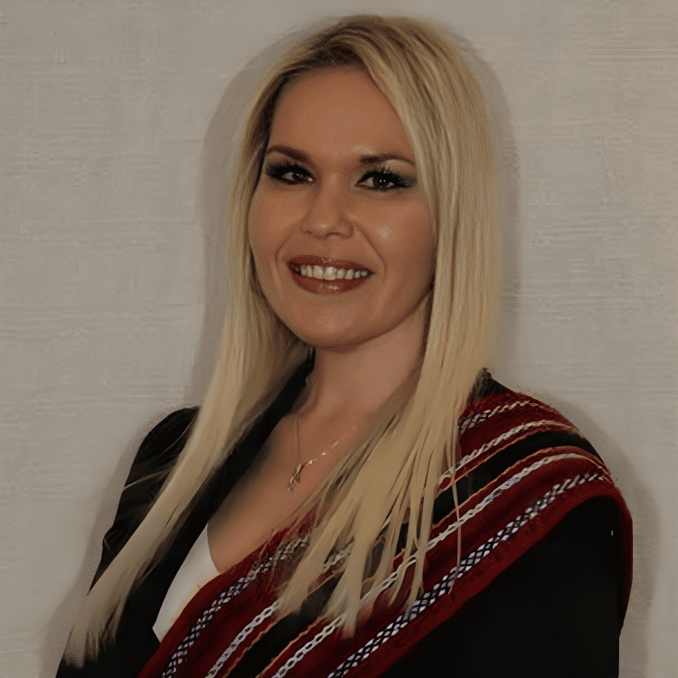 Smiling woman with long blonde hair.